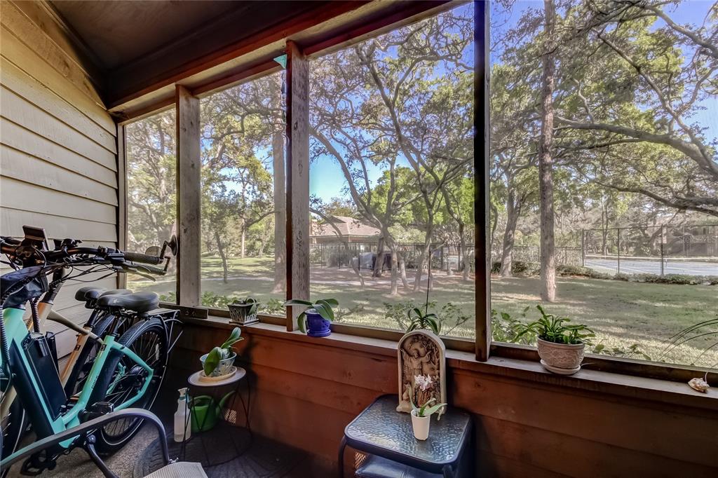 1407 Lennox Road East, Unit 1407 Palm Harbor, FL 34683 - Photo 36 of 48 a room with gym equipment and large windows