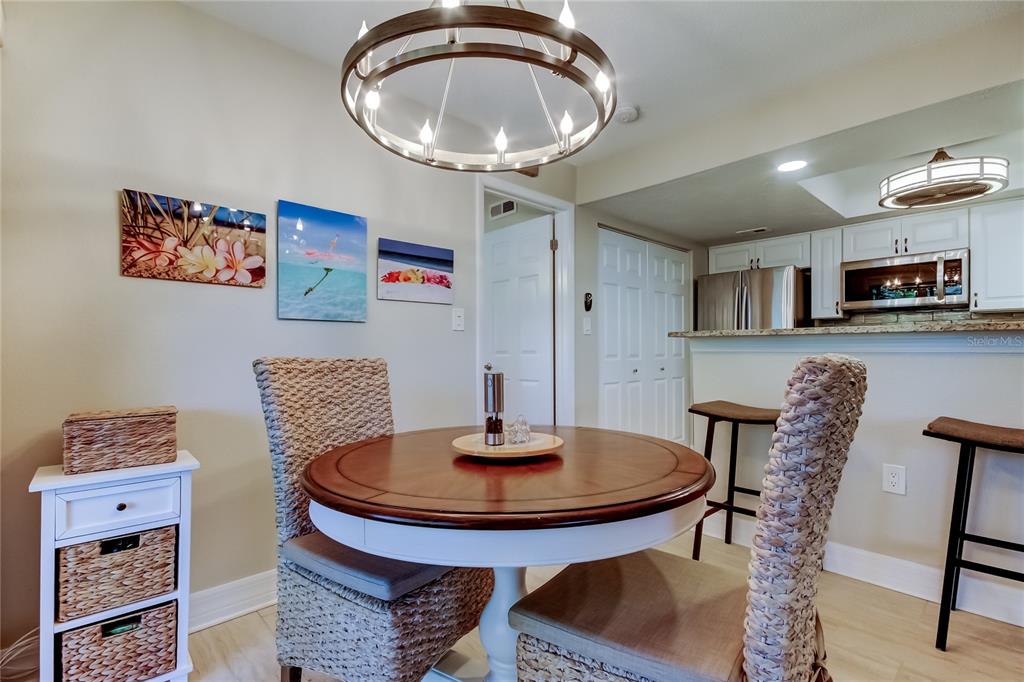 1407 Lennox Road East, Unit 1407 Palm Harbor, FL 34683 - Photo 8 of 48 a dining room with furniture and window