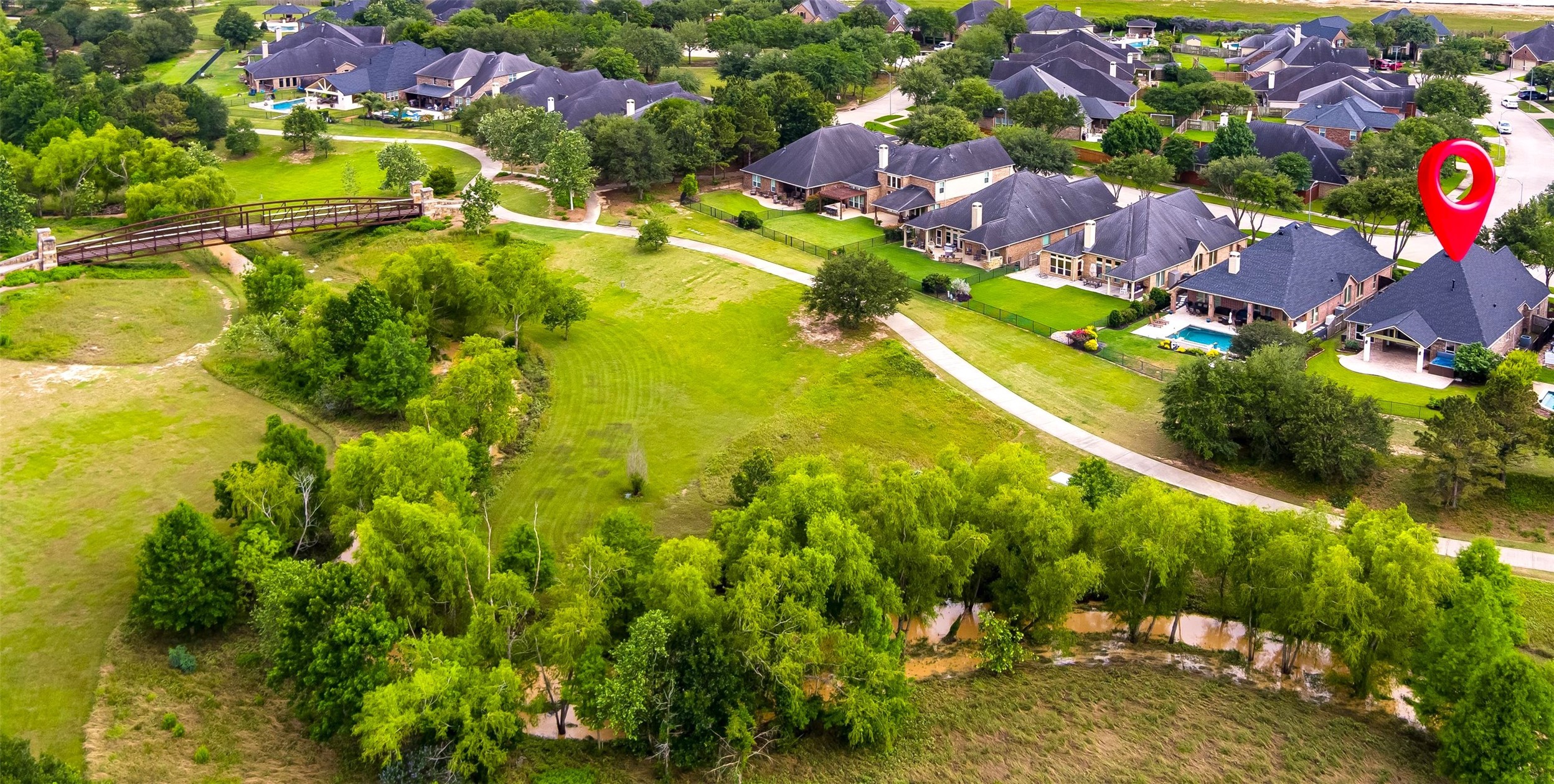 27714 Linden Ridge Lane Fulshear, TX 77441 - Photo 11 of 48 Backing to the wooded creek area that gives Creekside it's name, and a short distance to the pool, canine commons dog park, and pickleball courts, the home has a great location!