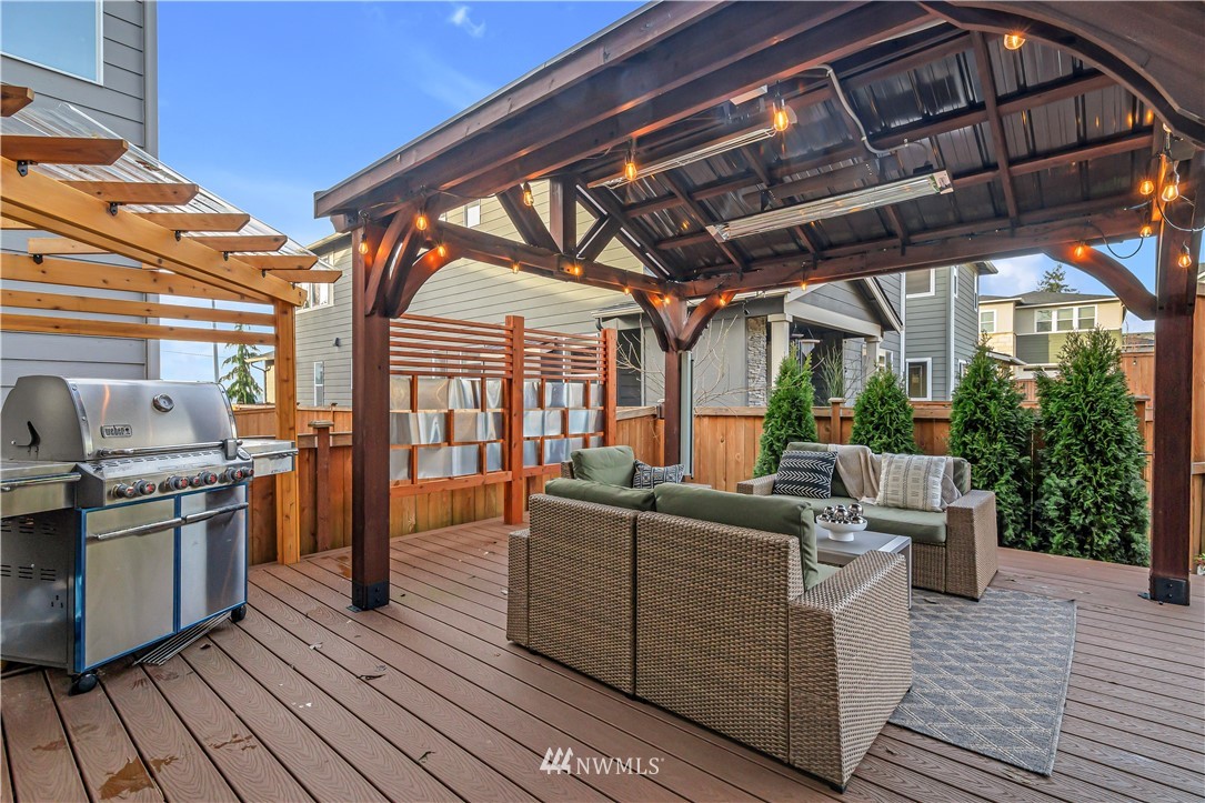 4319 224th Street Southeast Bothell, WA 98021 - Photo 30 of 40 a view of roof deck with couches under an umbrella