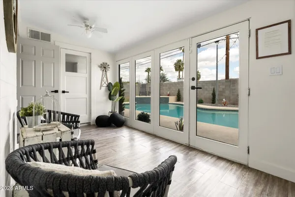 a view of a swimming pool with sitting area