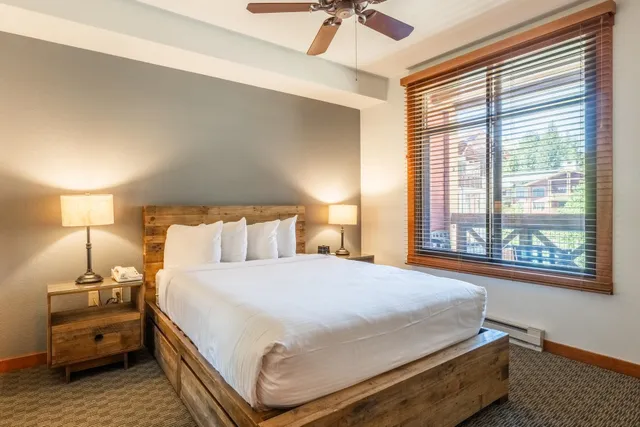 a bedroom with a bed and window