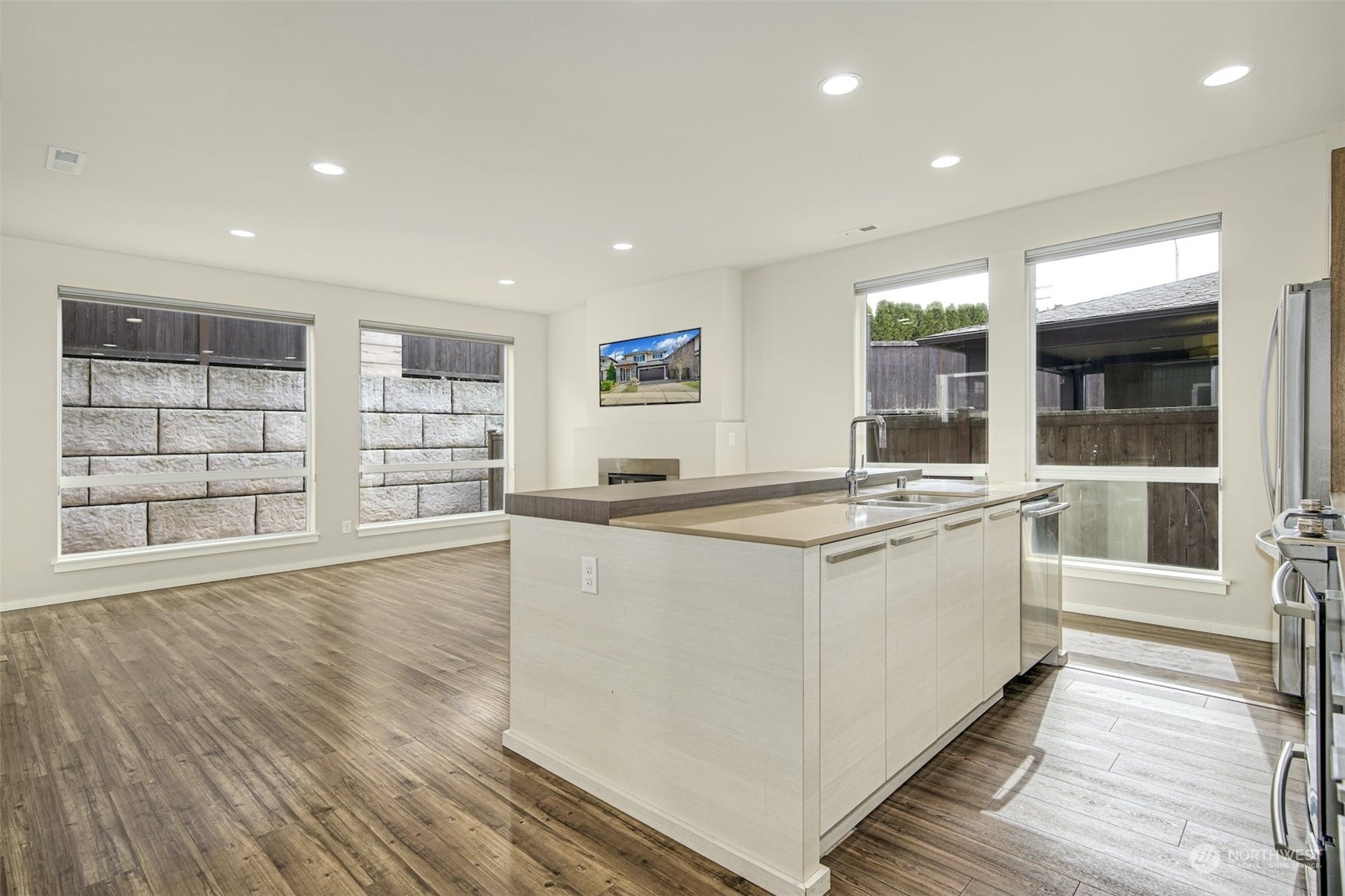 17025 40th Drive Southeast Bothell, WA 98012 - Photo 11 of 38 a large kitchen with stainless steel appliances granite countertop a large stove a sink and a large window