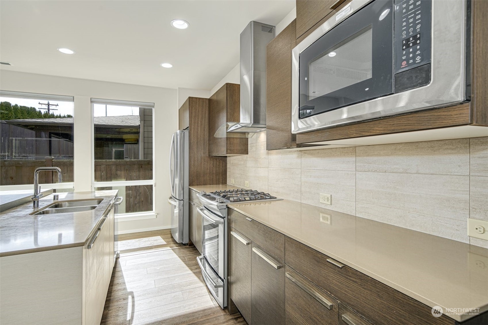 17025 40th Drive Southeast Bothell, WA 98012 - Photo 14 of 38 a kitchen with stainless steel appliances granite countertop a sink and a stove top oven