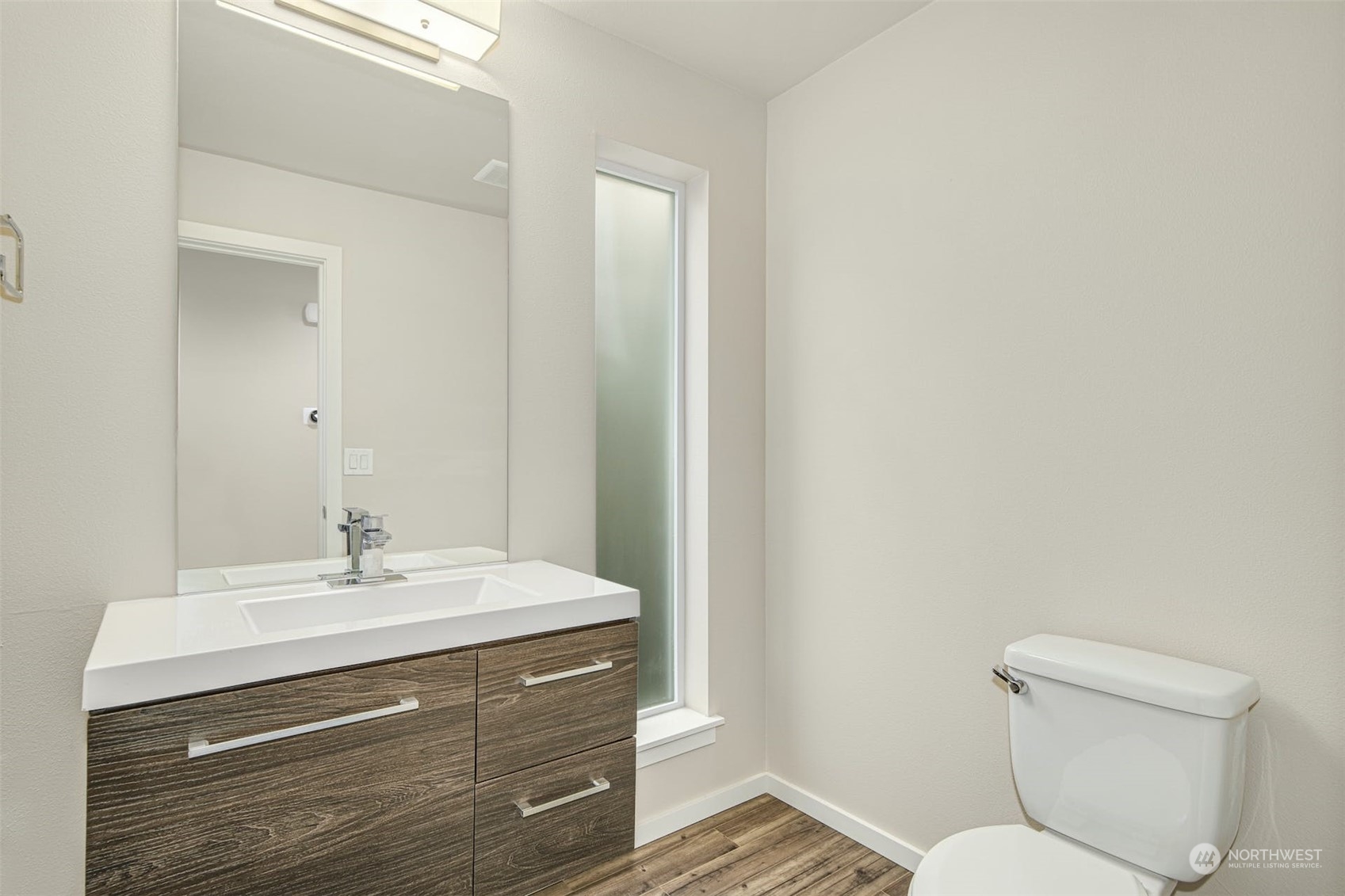 17025 40th Drive Southeast Bothell, WA 98012 - Photo 17 of 38 a bathroom with a sink mirror and a toilet