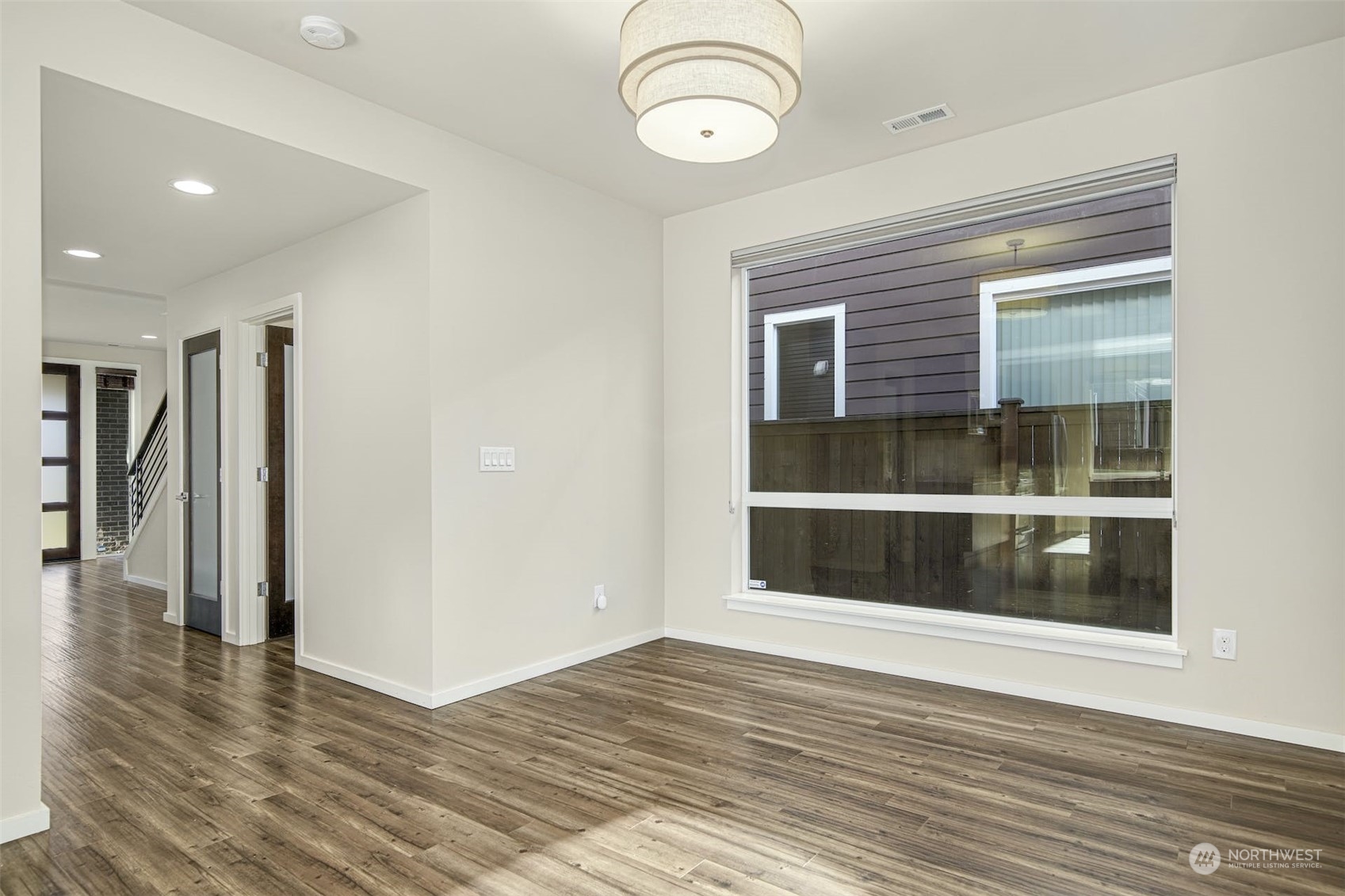 17025 40th Drive Southeast Bothell, WA 98012 - Photo 9 of 38 a view of empty room with wooden floor