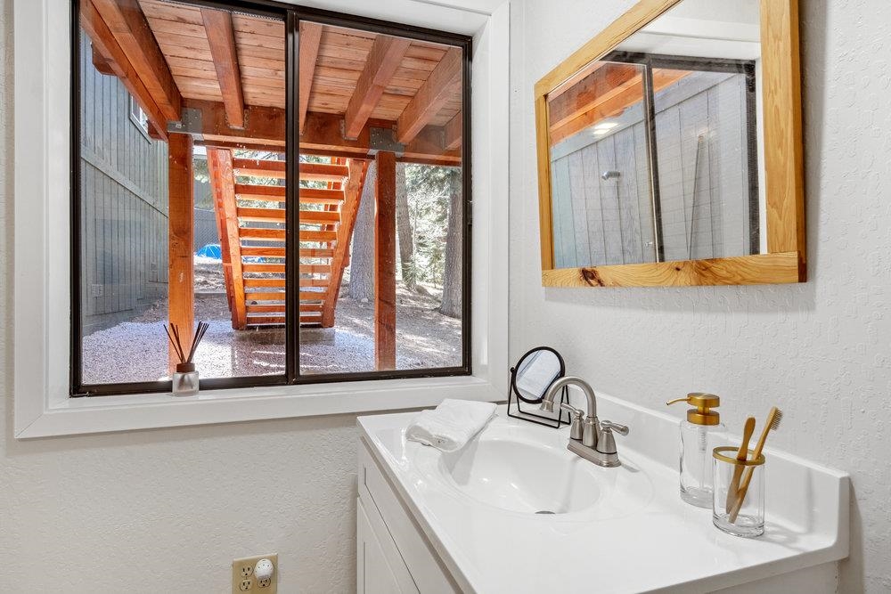 12068 Pine Forest Road Truckee, CA 96161 - Photo 19 of 27 a bathroom with a sink and a window