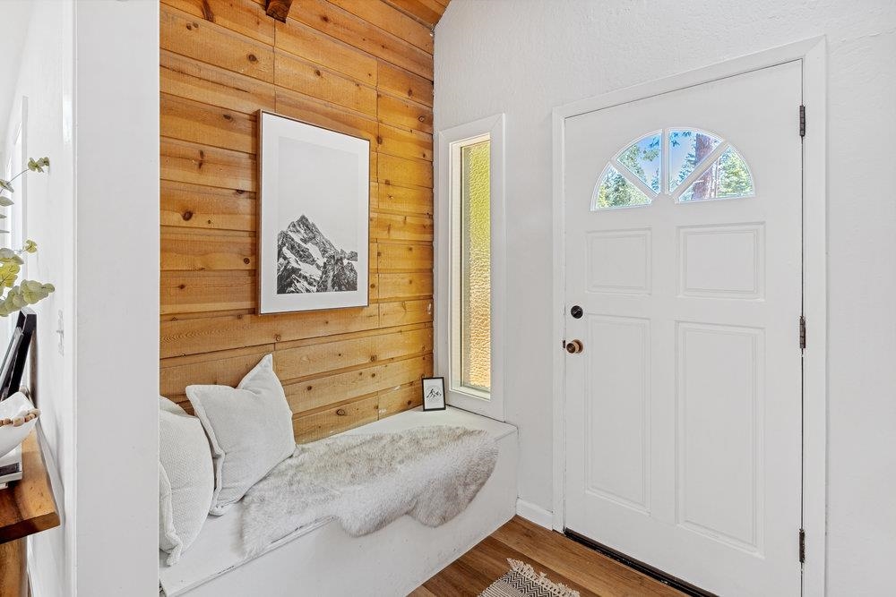 12068 Pine Forest Road Truckee, CA 96161 - Photo 23 of 27 a bedroom with a bed and a painting on the wall