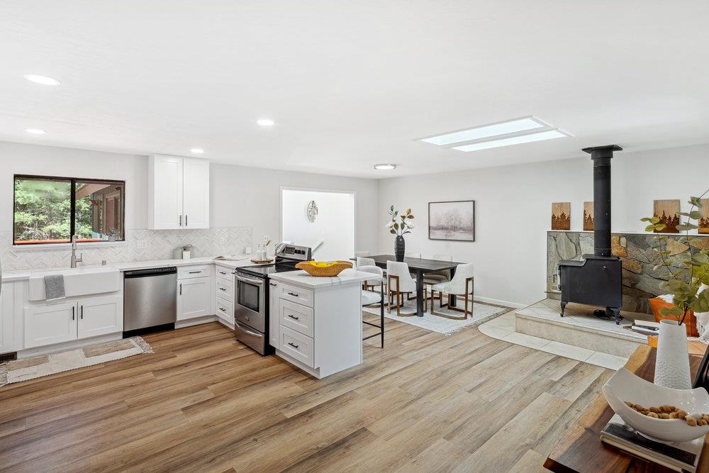 12068 Pine Forest Road Truckee, CA 96161 - Photo 3 of 27 a kitchen that has a lot of cabinets a sink and appliances in it