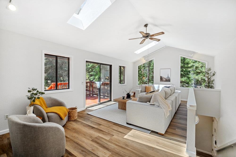 12068 Pine Forest Road Truckee, CA 96161 - Photo 5 of 27 a living room with furniture and a large window