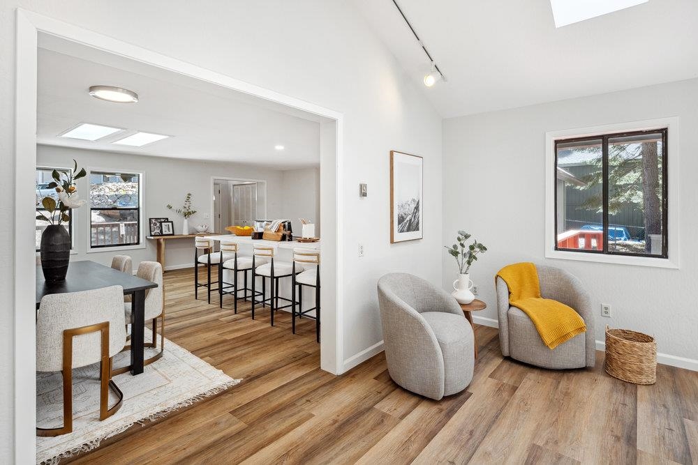 12068 Pine Forest Road Truckee, CA 96161 - Photo 9 of 27 a living room with furniture and a wooden floor