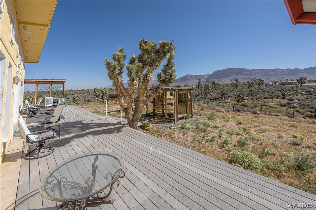 26512 North Yucca Road Meadview, AZ 86444 - Photo 14 of 38 Expansive outdoor deck with desert landscaping and distant mountain views