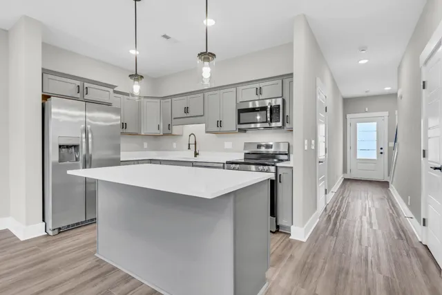a kitchen that has a lot of cabinets in it