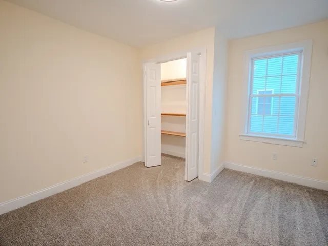 a view of an empty room and entryway
