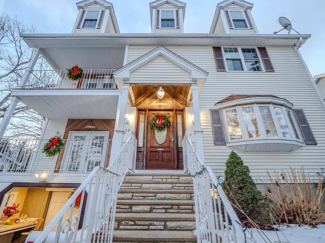 a view of a hallway with wooden floor and plant