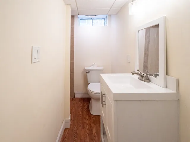 a kitchen with granite countertop a sink cabinets and stainless steel appliances