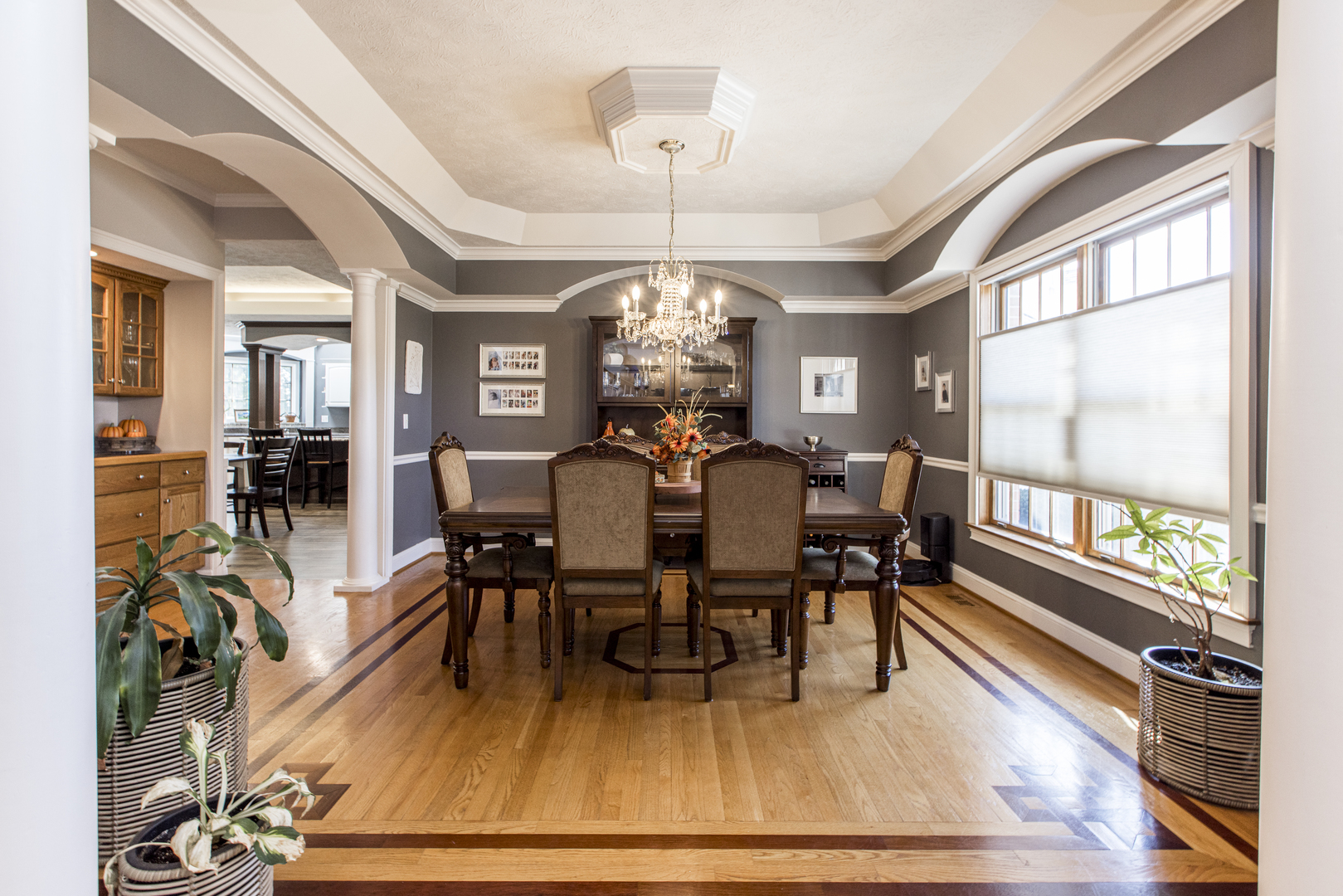 13765 Deer Ridge Road Bloomington, IL 61705 - Photo 6 of 41 a view of a dining room with furniture a chandelier and wooden floor