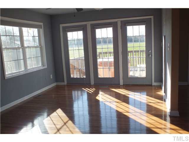 1874 Steven's Chapel Road Smithfield, NC 27577 - Photo 1 of 22 Family Room with new vinyl windows and hardwood floors