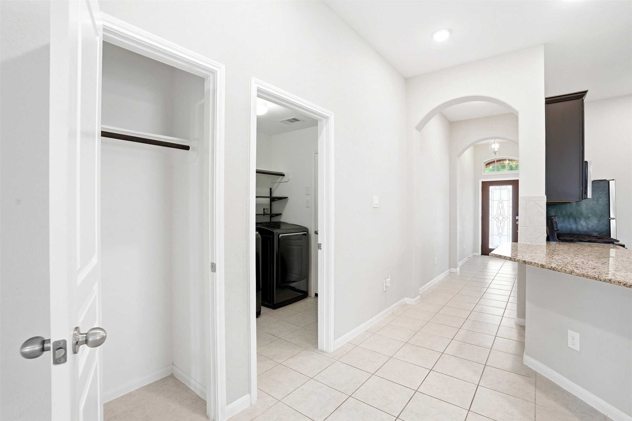 3718 Logandale Ridge Lane Katy, TX 77493 - Photo 13 of 28 Extra storage closet and laundry room leads to garage