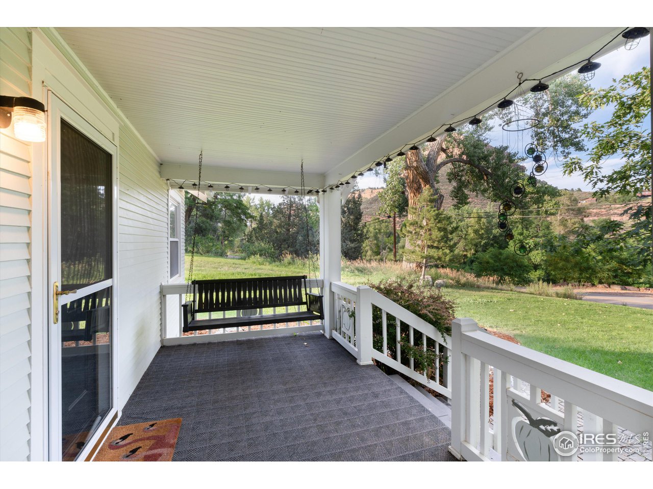 877 Apple Valley Road Lyons, CO 80540 - Photo 5 of 40 Front porch for relaxing and listening to the river