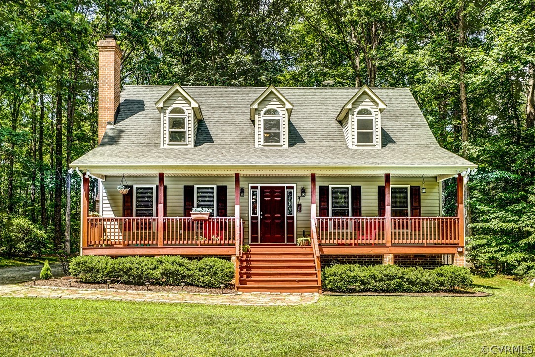 135 Rolling Path Road Louisa, VA 23093 - Photo 1 of 43 a front view of a house with a yard