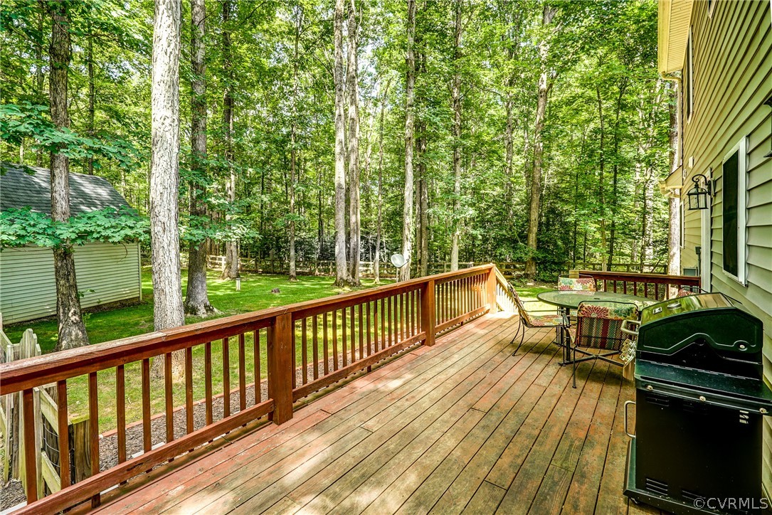 135 Rolling Path Road Louisa, VA 23093 - Photo 43 of 43 a view of a patio with chairs next to a yard