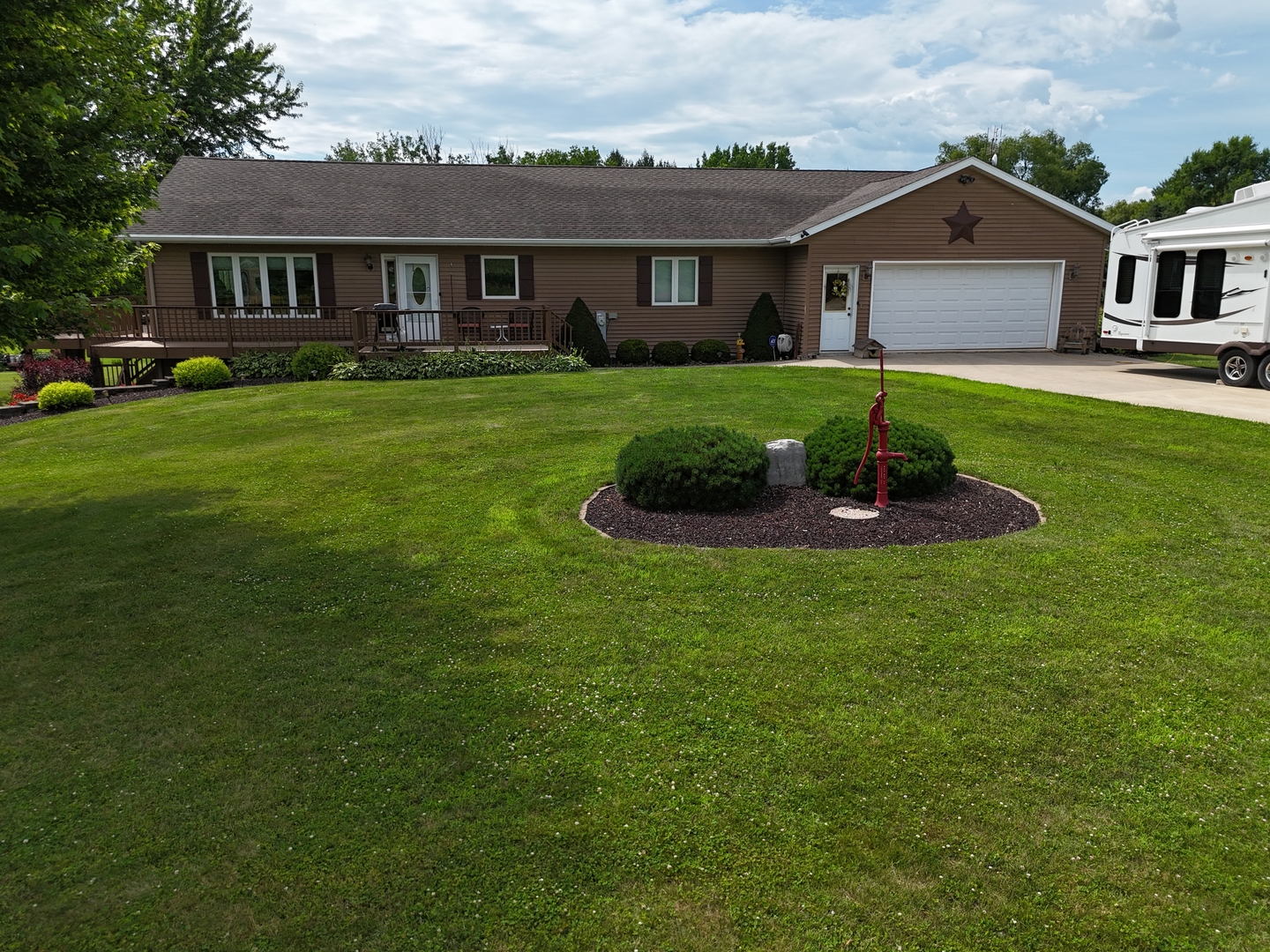 5782 North Brown Road Dakota, IL 61018 - Photo 13 of 49 a front view of a house with a yard and trees