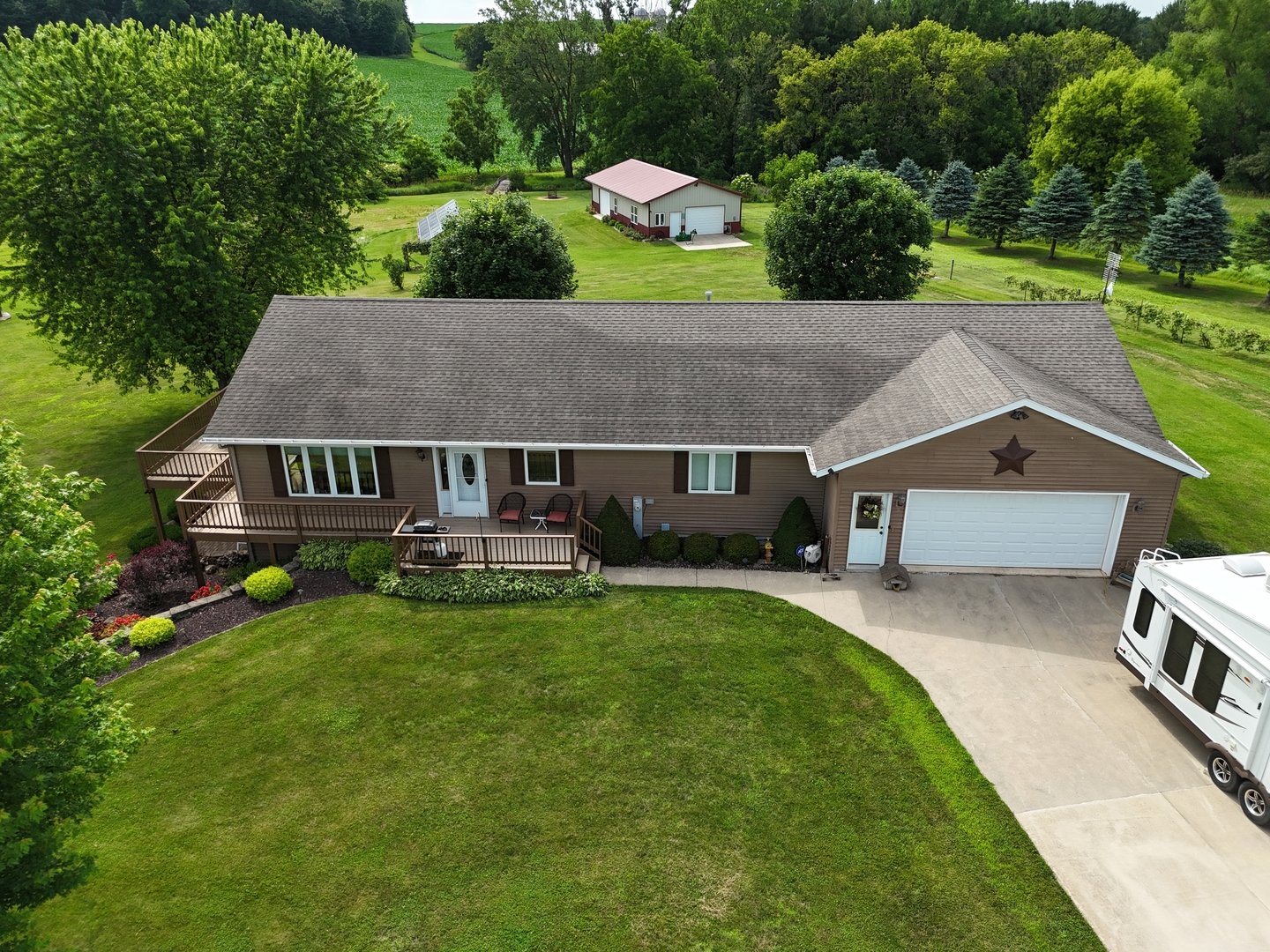 5782 North Brown Road Dakota, IL 61018 - Photo 16 of 49 a aerial view of a house with swimming pool next to a big yard