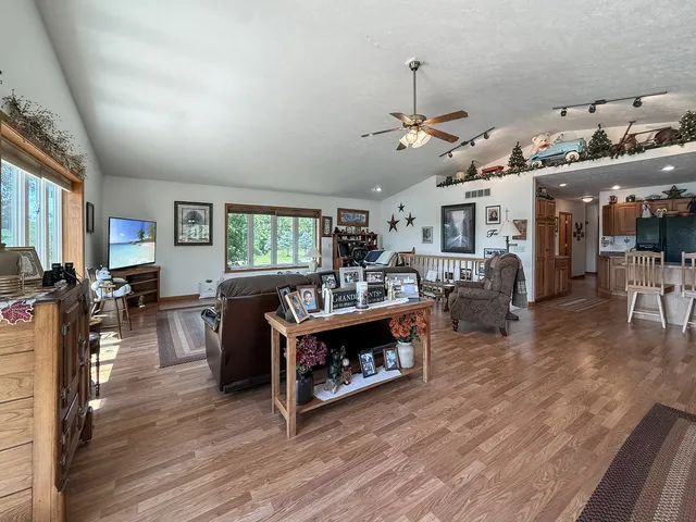 a view of a livingroom with furniture and a window