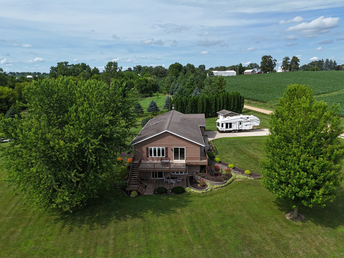 5782 North Brown Road Dakota, IL 61018 - Photo 2 of 46 a view of a house with a big yard and sitting area