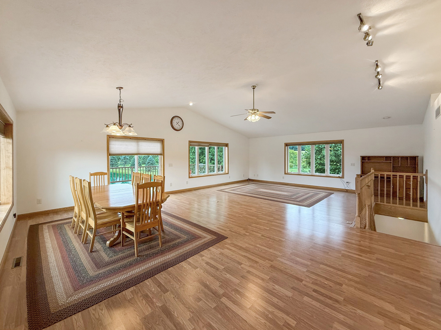 5782 North Brown Road Dakota, IL 61018 - Photo 24 of 46 a dining room with wooden floor a chandelier a wooden table and chairs