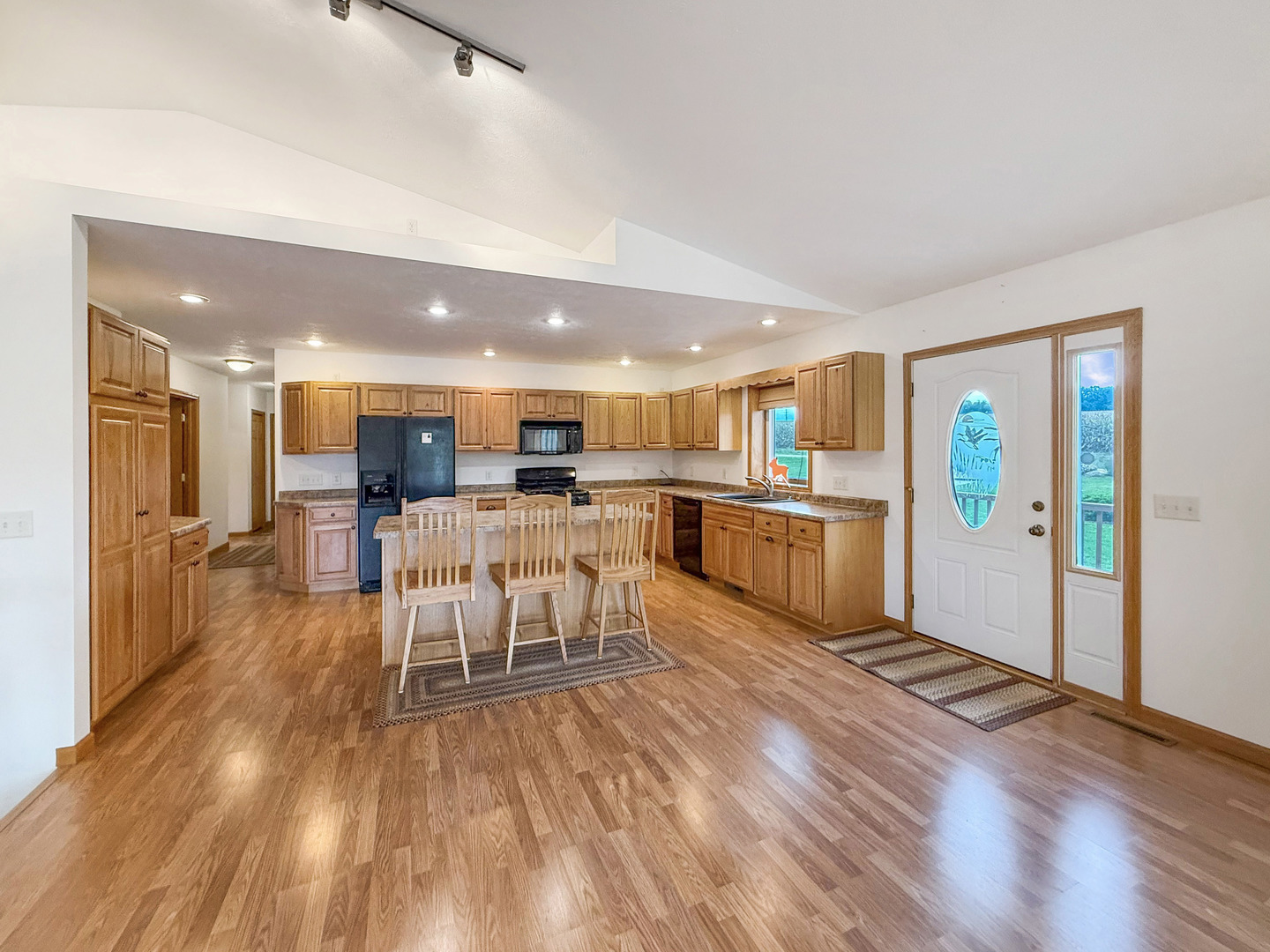 5782 North Brown Road Dakota, IL 61018 - Photo 26 of 49 a living room with stainless steel appliances furniture refrigerator and a kitchen view