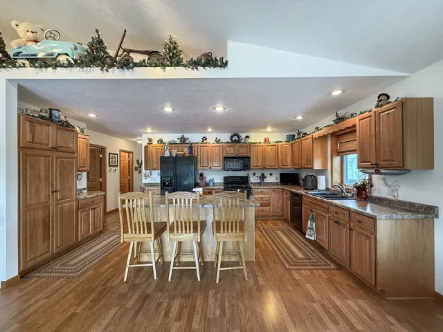 a spacious bedroom with a bed and a chandelier