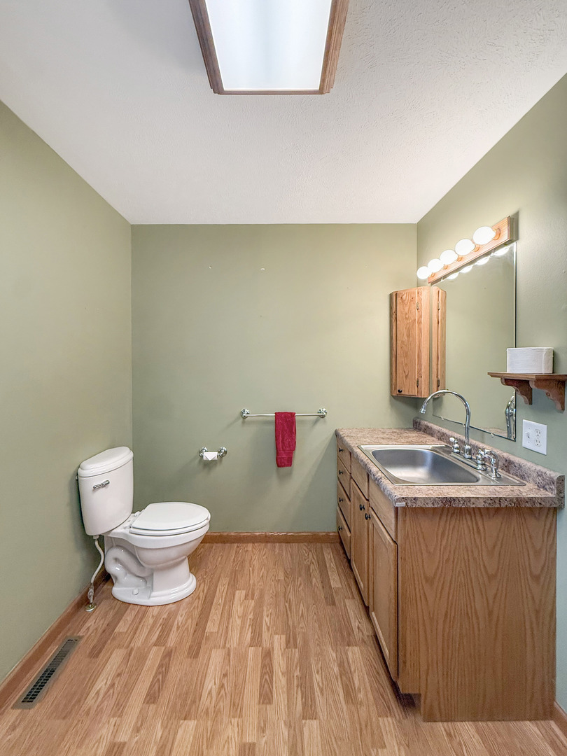 5782 North Brown Road Dakota, IL 61018 - Photo 30 of 46 a bathroom with a sink and a toilet