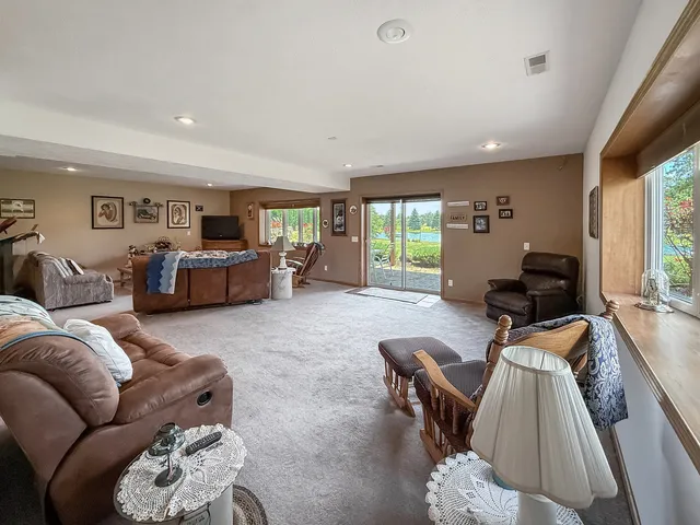 a large kitchen with stainless steel appliances lots of counter space and furniture