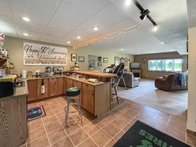 a living room with furniture and a gym