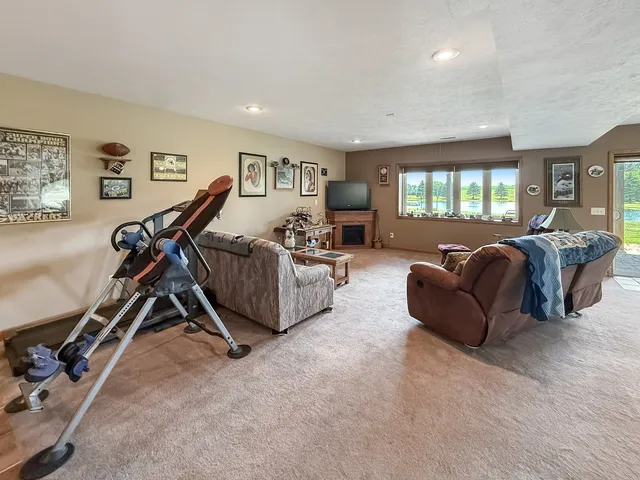 an aerial view of a house with swimming pool and garden