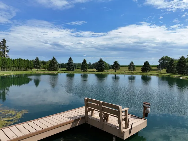 a view of a lake with houses in the background