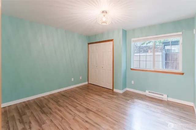 a bathroom with a toilet sink vanity and mirror