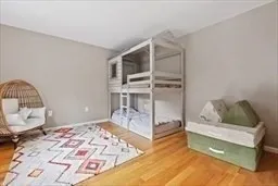 a bedroom with a bed window and flowerpot