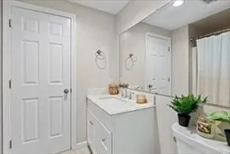 a bathroom with a sink a vanity and a mirror