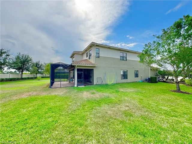 a view of yard with grass & street