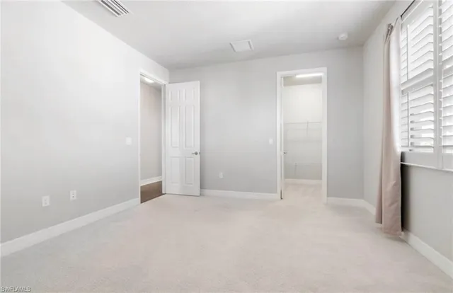 a bathroom with a granite countertop sink a toilet and bathtub