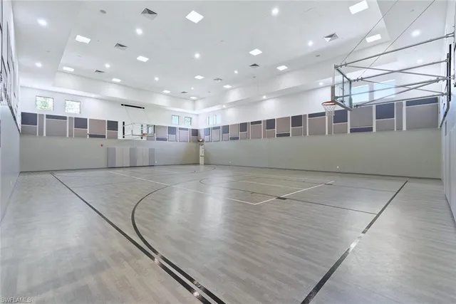 a view of a swimming pool with a table and chairs