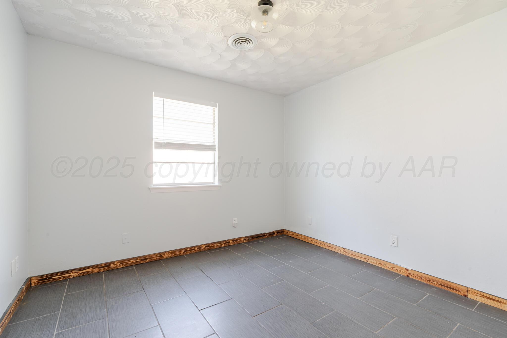 5210 South Milam Street Amarillo, TX 79110 - Photo 17 of 22 a view of a room with window