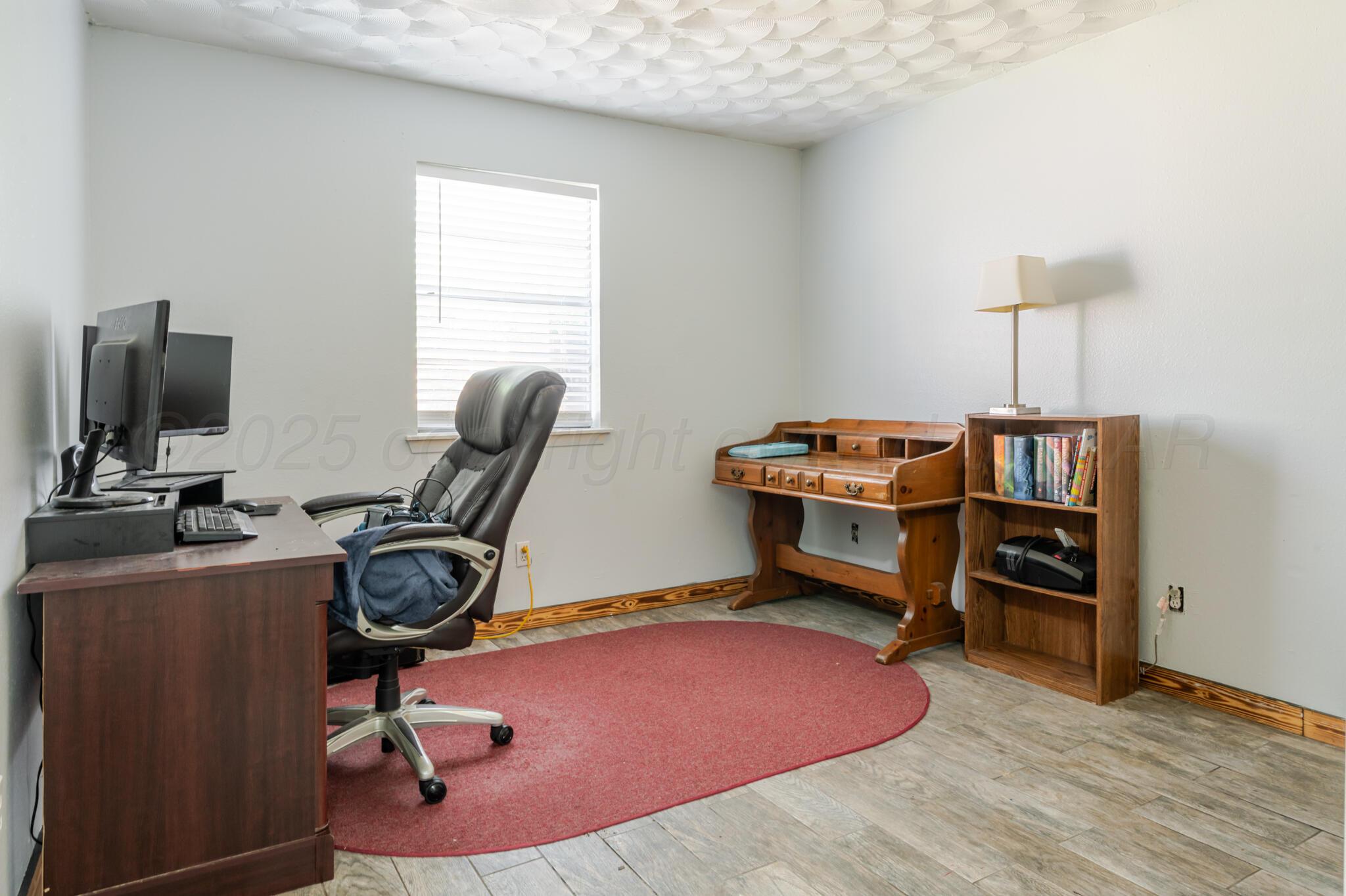 5210 South Milam Street Amarillo, TX 79110 - Photo 18 of 22 a room with furniture and a window