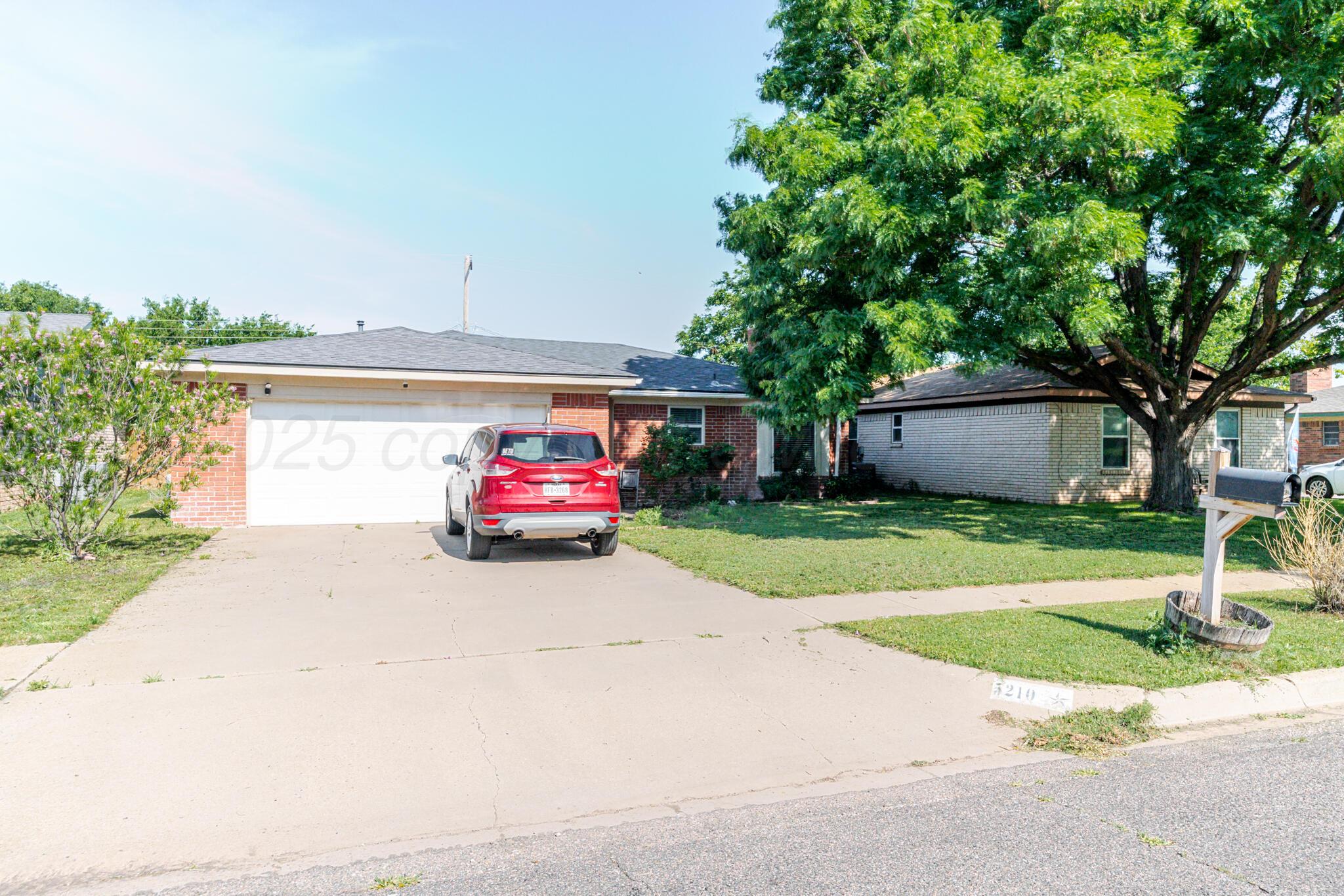 5210 South Milam Street Amarillo, TX 79110 - Photo 2 of 22 a car parked in front of a house