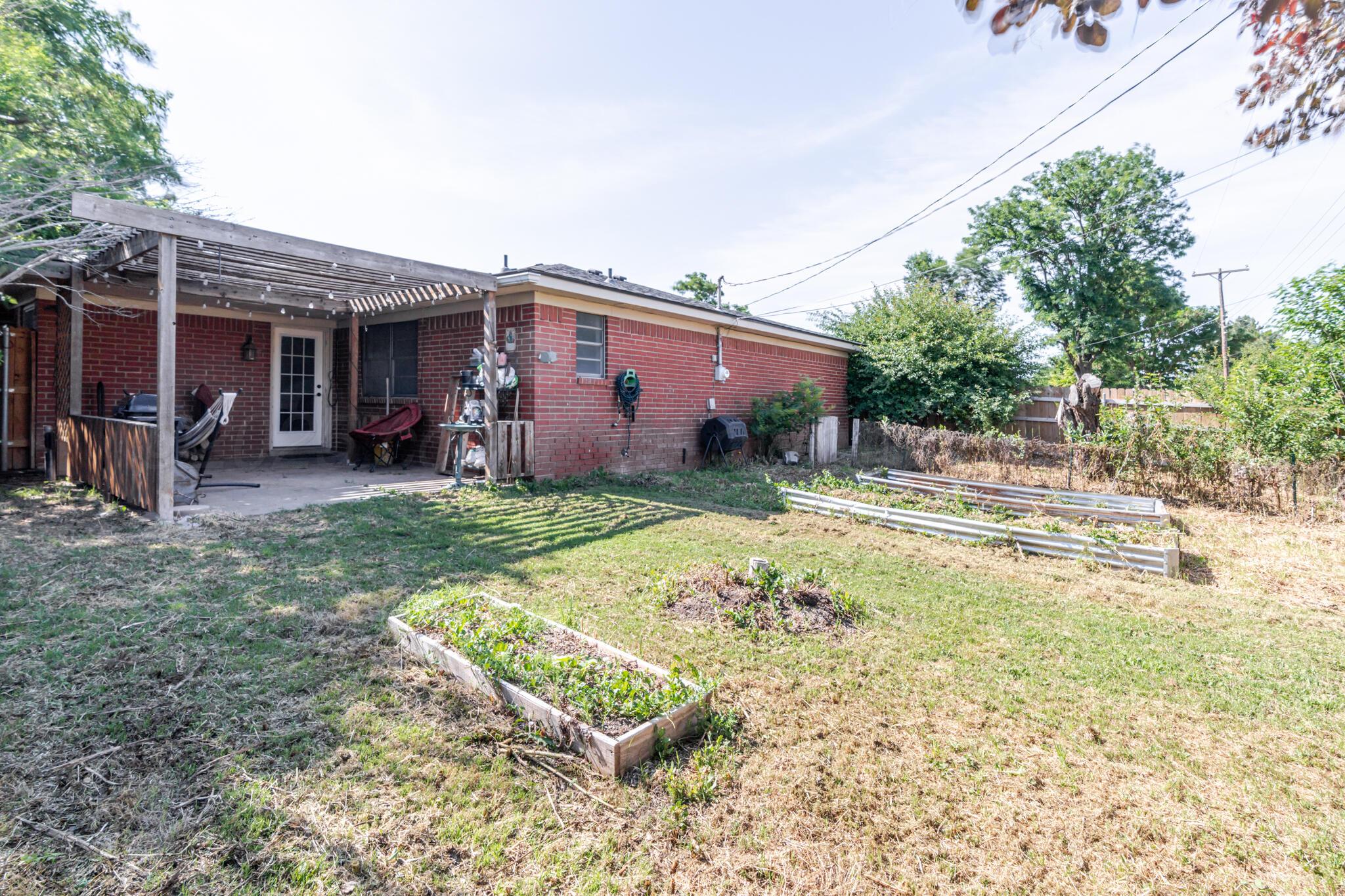 5210 South Milam Street Amarillo, TX 79110 - Photo 22 of 22 a backyard of a house with yard and outdoor seating