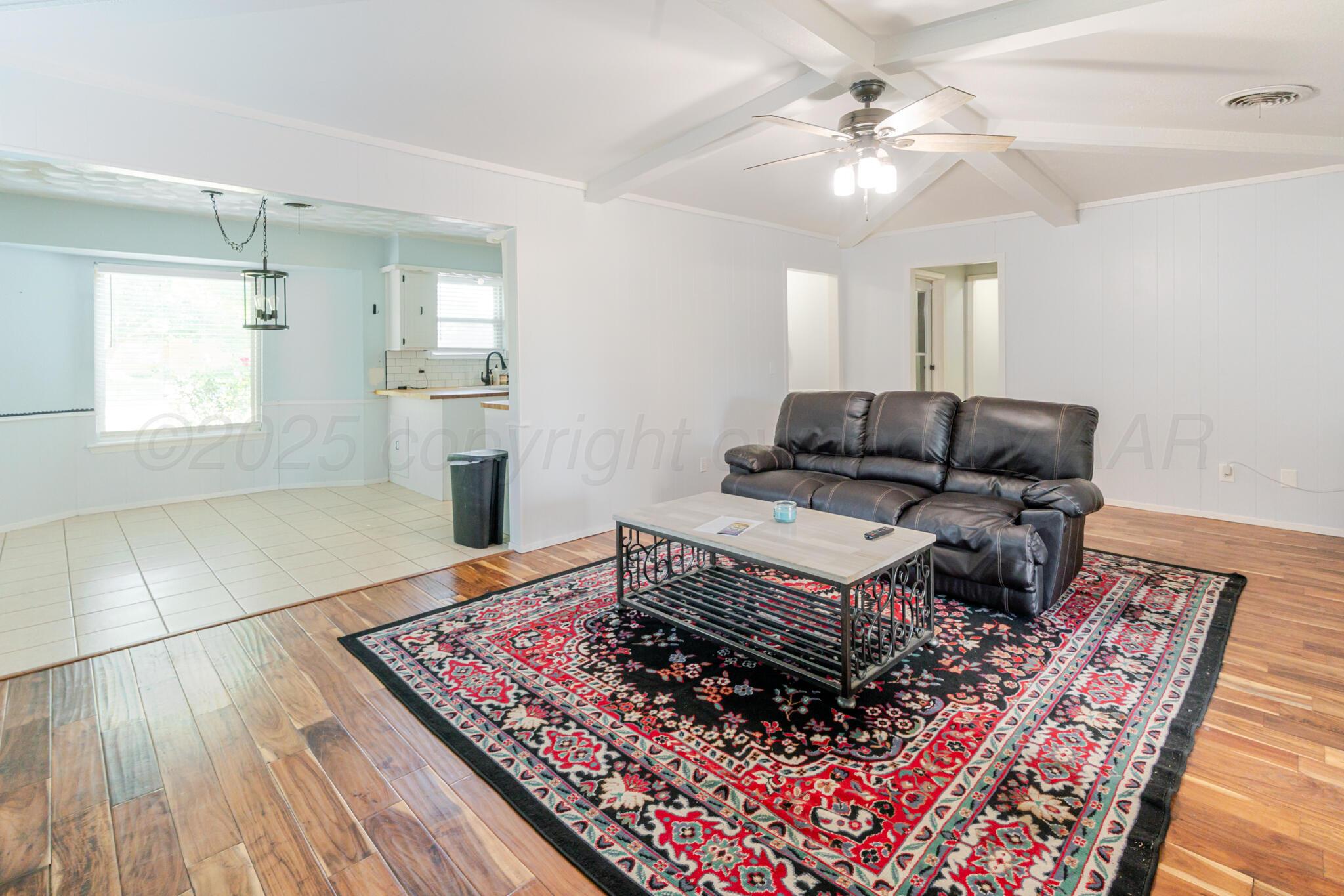 5210 South Milam Street Amarillo, TX 79110 - Photo 10 of 22 a living room with furniture and a rug