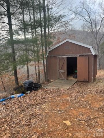 151 Thunderstruck Ridge Burnsville, NC 28714 - Photo 12 of 13 a front view of a house with a yard